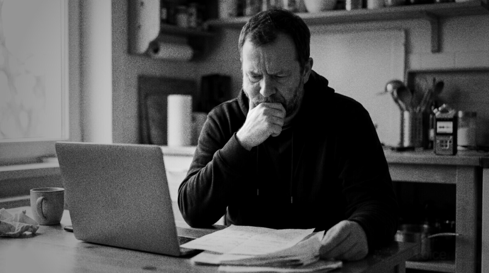 A voice actor at his kitchen table thinking hard over a job offer © The Voice Realm