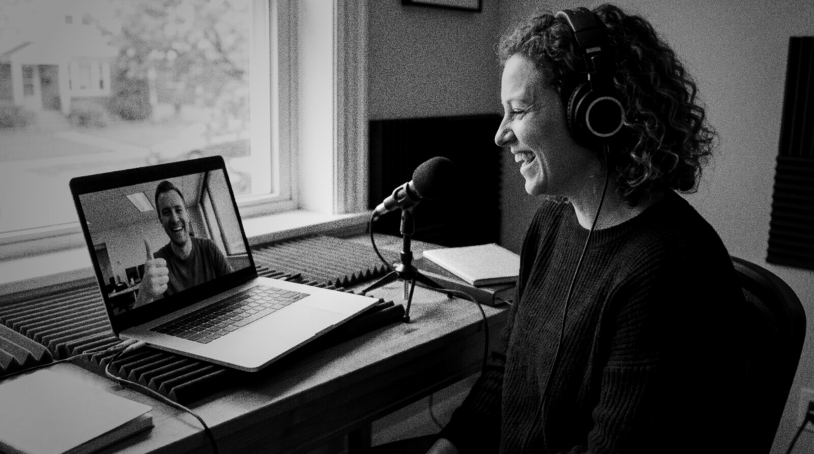 A happy voice actor on a video call with a smiling client giving a thumbs up © The Voice Realm