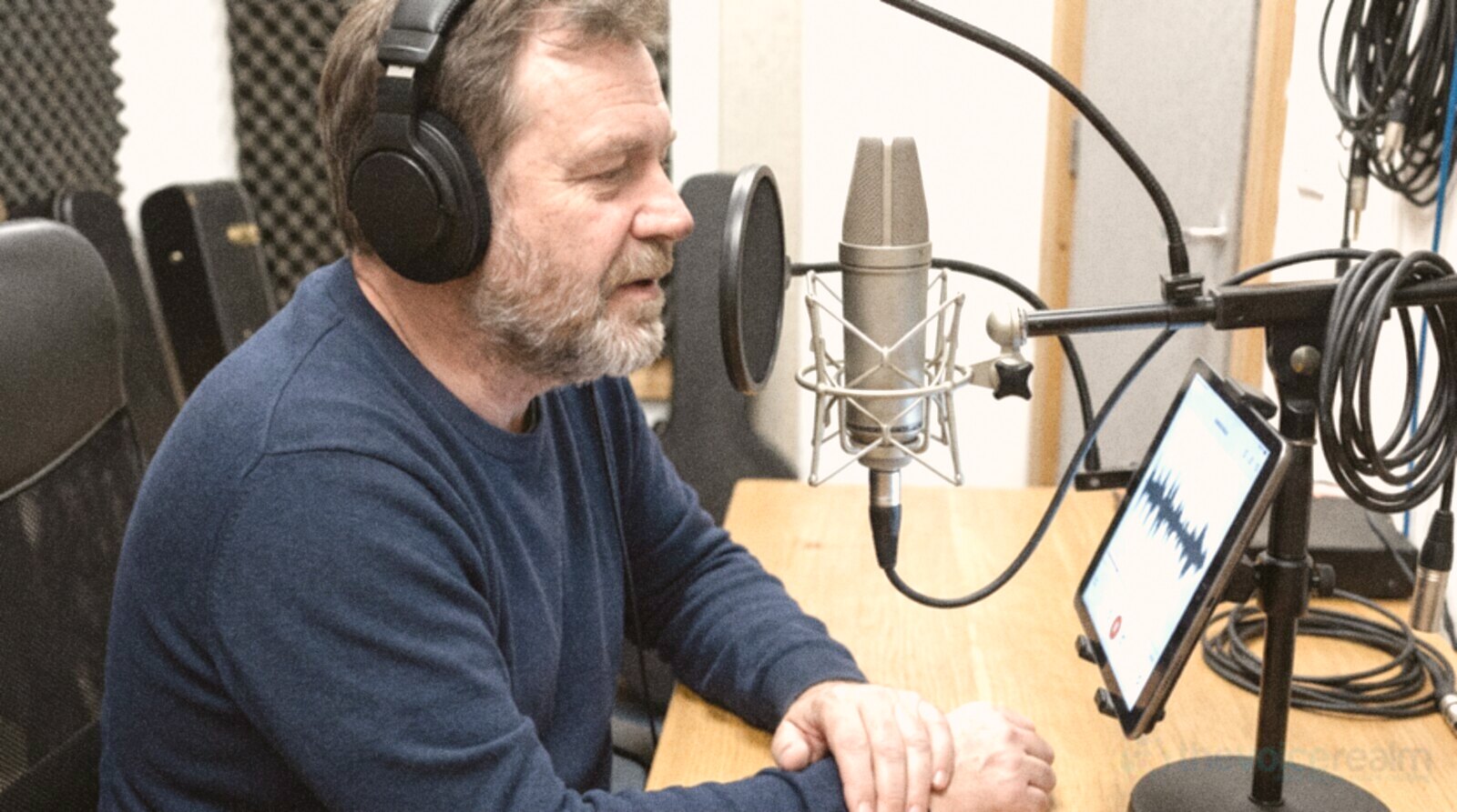 A male voice actor recording a voiceover for a campaign advert in a studio © The Voice Realm