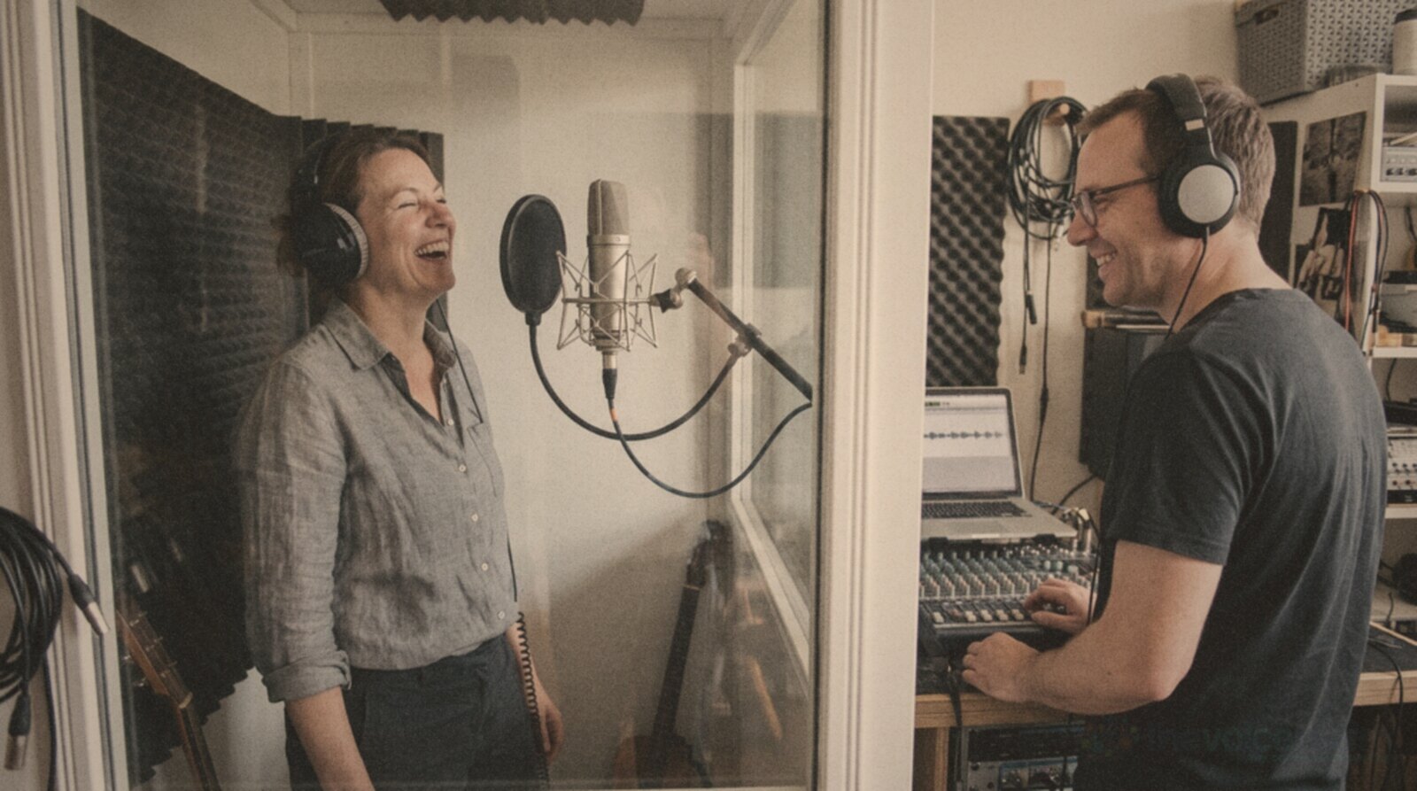 A voice actor sharing a laugh with the engineer during a session © The Voice Realm