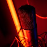 Studio microphone inside a professional voice recording booth